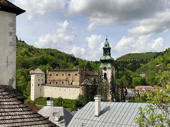 View of historical mining town banska stiavnica slovakia church tower castle and green hills.