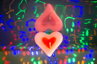 Close-up of illuminated heart shape in swimming pool