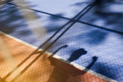 High angle view of shadow on floor