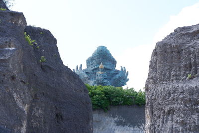 Rock formations on mountain against sky