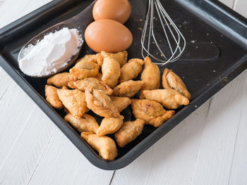 High angle view of bread in container on table