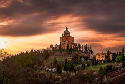 View of historic building against sky during sunset