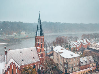 High angle view of buildings against sky during winter