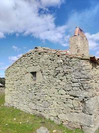 Low angle view of old building against sky