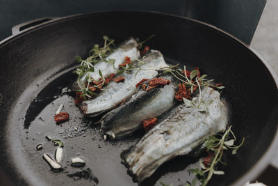 Close-up of fish in cooking pan