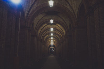 Illuminated pendant lights in tunnel