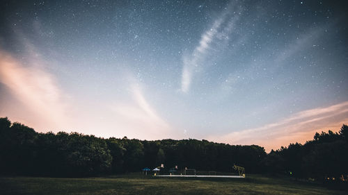 Scenic view of field against sky at night