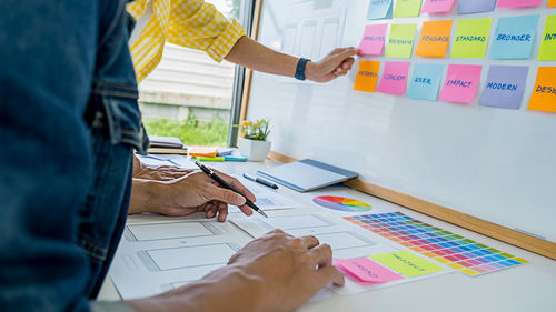 Cropped image of business colleagues working in office