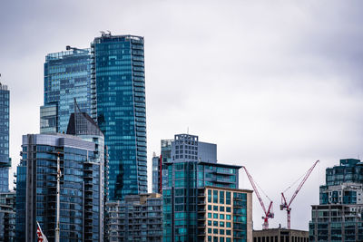 Skyscrapers in city against sky