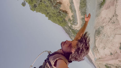 Low angle view of woman on the wall