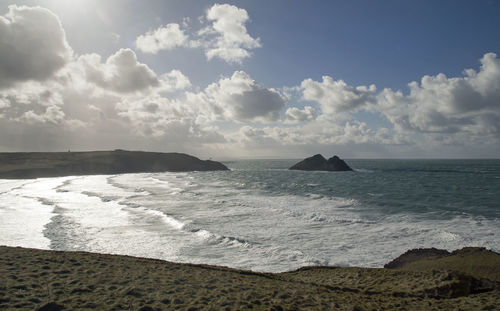 Scenic view of beach against sky