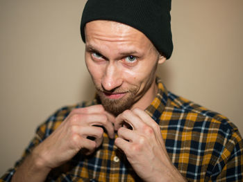 Portrait of young man wearing hat