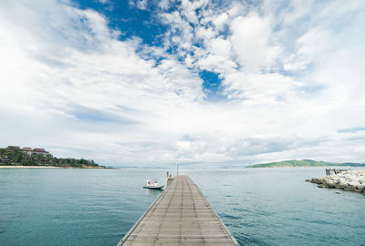 Pier over sea against sky