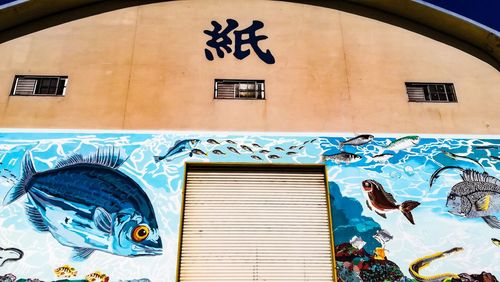 Low angle view of graffiti on building wall