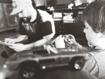 High angle view of people in toy car