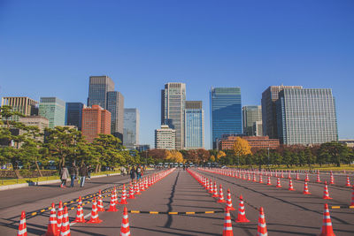 View of buildings against clear blue sky