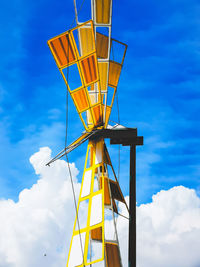 Low angle view of tower against blue sky