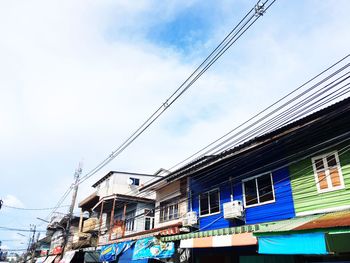 Low angle view of houses against sky