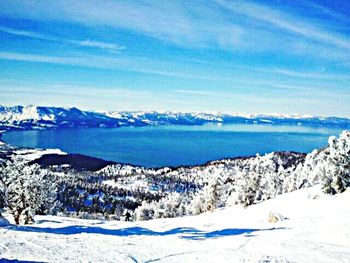 Scenic view of mountains against cloudy sky