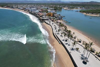 High angle view of sea and city