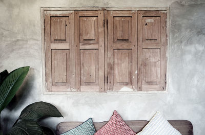 Low section of person on wooden door of building