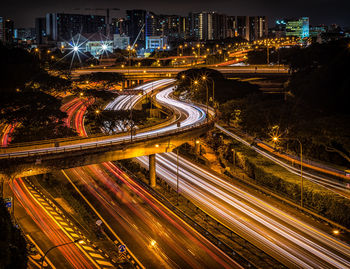 High angle view of light trails on road at night