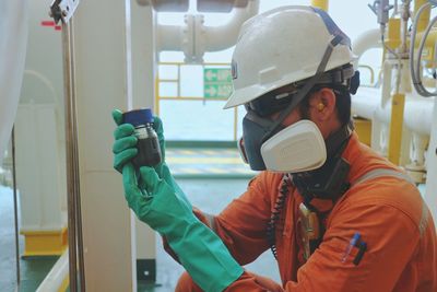 Worker examining sample