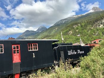 Train against mountains and sky