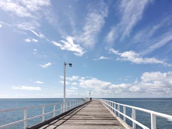 Pier over sea against sky