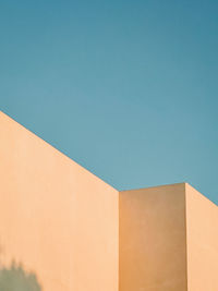 Low angle view of building against clear blue sky