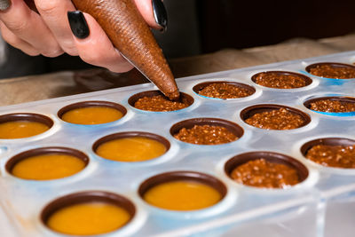 Midsection of person preparing food