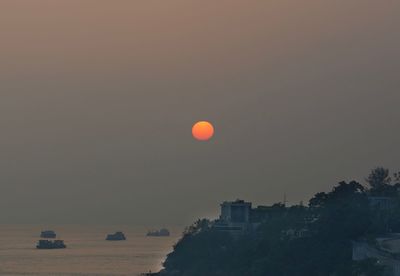Scenic view of sea against clear sky during sunset