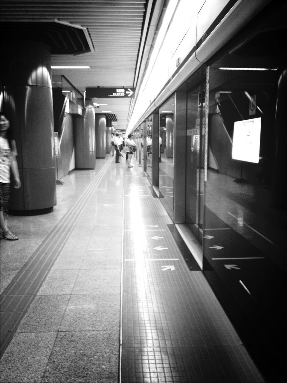 indoors, transportation, public transportation, railroad station, men, person, subway station, lifestyles, passenger, railroad station platform, illuminated, subway, travel, ceiling, architecture, incidental people, flooring, built structure