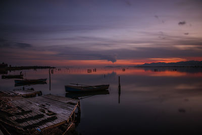 Scenic view of lake against sky during sunset