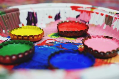 Close-up of multi colored pencils on table