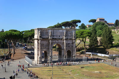 Group of people in front of built structure