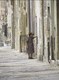 Full length of man in front of built structure