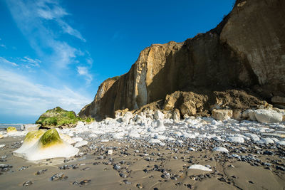 Scenic view of beach against sky during winter