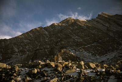 Low angle view of rocks against sky