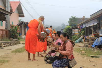 Rear view of people on building