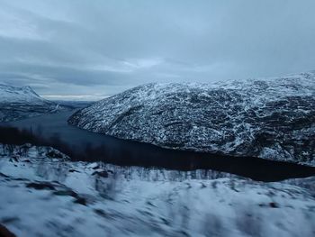 Scenic view of snowcapped mountains against sky, road to norway