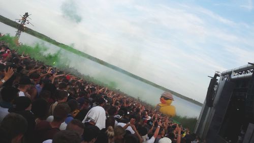 High angle view of people standing against sky