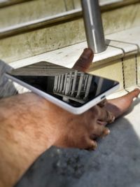 Close-up of man using mobile phone