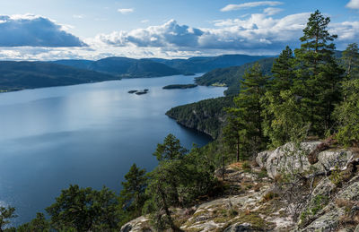 Scenic view of lake and mountains against sky