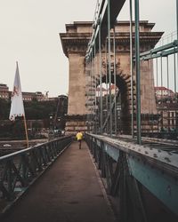 View of bridge and buildings against sky