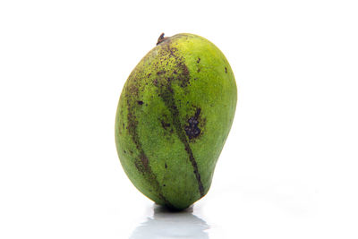 Close-up of fruit against white background