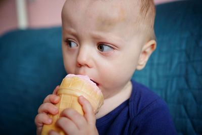 Child eats pink ice cream