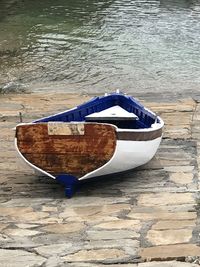 Close-up of boat moored on beach