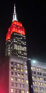 Low angle view of illuminated building at night