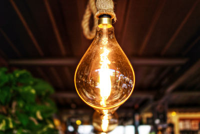 Close-up of illuminated light bulb